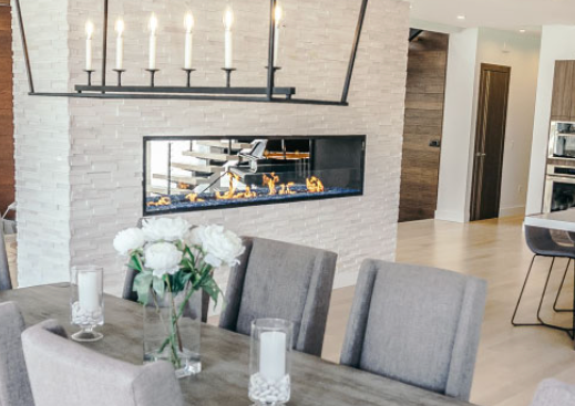 2 sided fireplace in a white wall